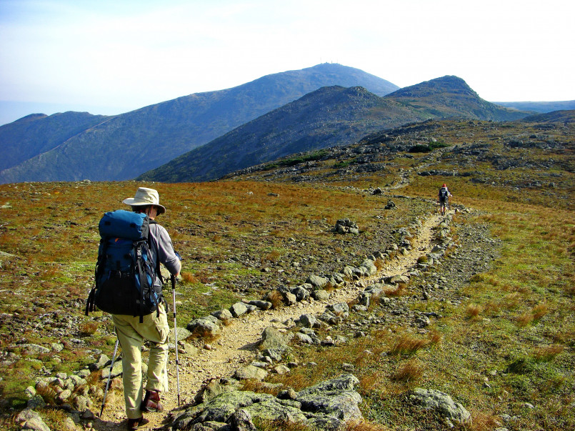 Appalachian trail hikers white mountains Hikers traversing a rocky section of the Appalachian Trail in the White Mountains of New Hampshire