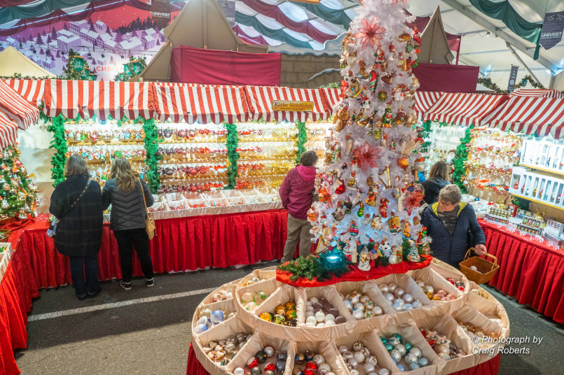 Bethlehem Pennsylvania Christmas market Christkindlmarkt in Bethlehem with wooden market stalls, holiday decorations and shoppers browsing crafts