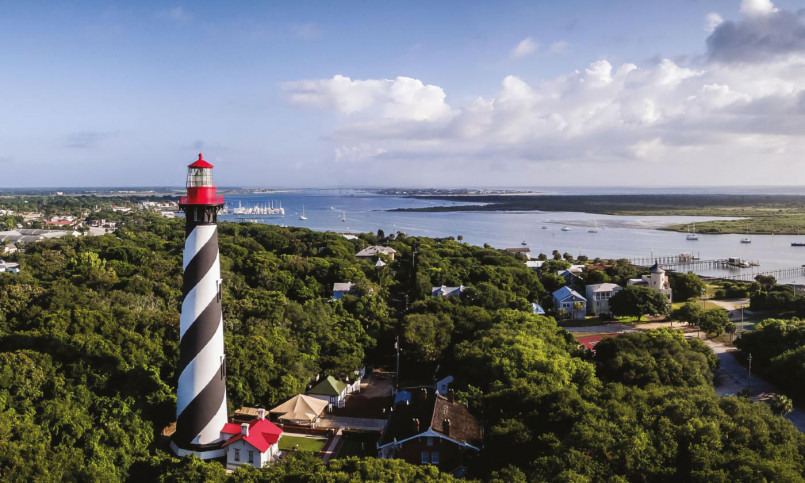 St Augustine Lighthouse Florida Black and white striped lighthouse tower against blue sky in St. Augustine