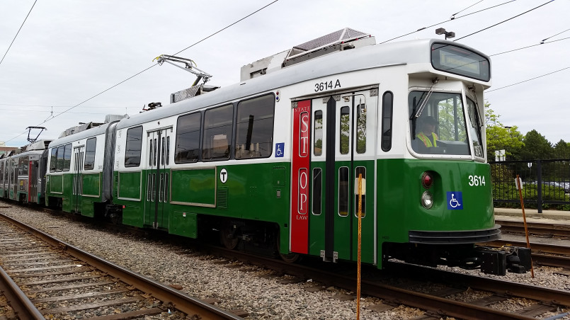 Boston mbta green line trolley MBTA Green Line trolley on Commonwealth Avenue in Boston