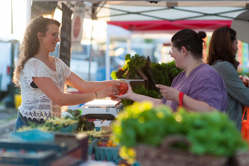 Bustling farmers market in Traverse City with fresh local produce and artisanal foods