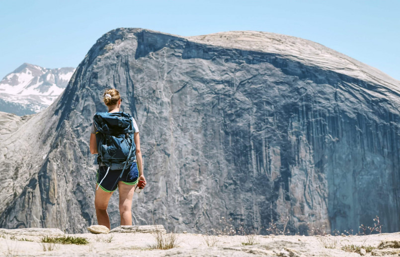 Hikers on the trail to Half Dome in Yosemite National Park with valley views below