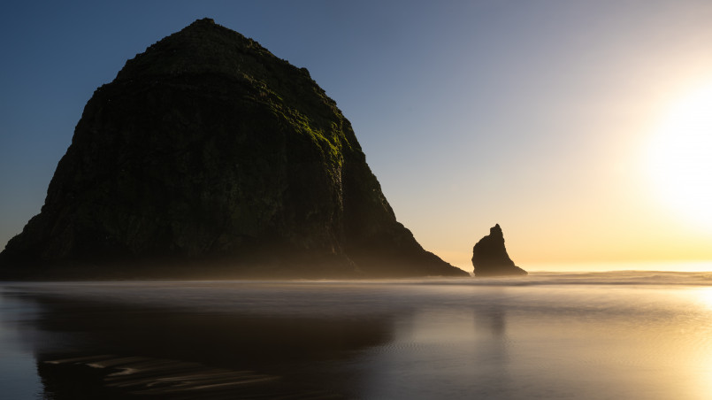 Cannon Beach Oregon Haystack Rock Cannon Beach with iconic Haystack Rock formation at sunset with tide pools