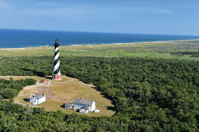 Cape hatteras lighthouse outer banks north carolina Cape Hatteras Lighthouse with beach dunes in foreground