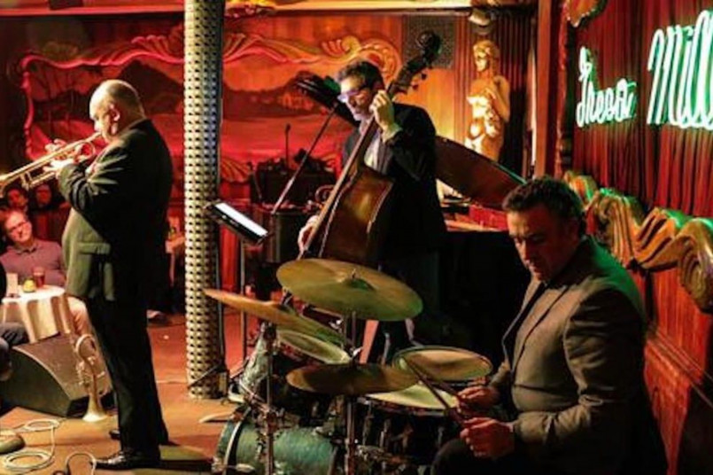 Chicago blues club performance Blues guitarist performing in a Chicago club with patrons enjoying the music