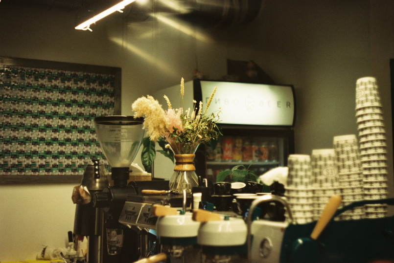 Baristas working behind a long bar at Intelligentsia Coffee's modern Chicago location
