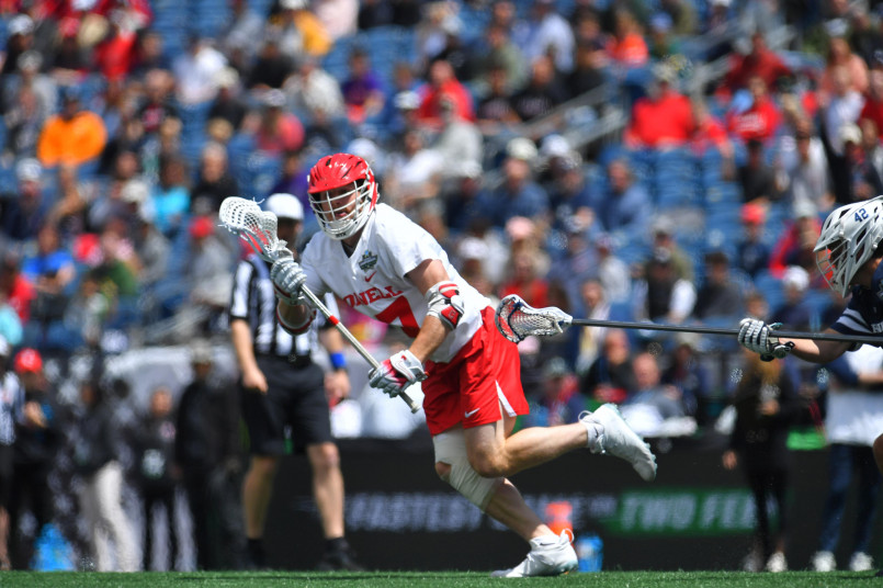 College lacrosse players in action during an NCAA championship game