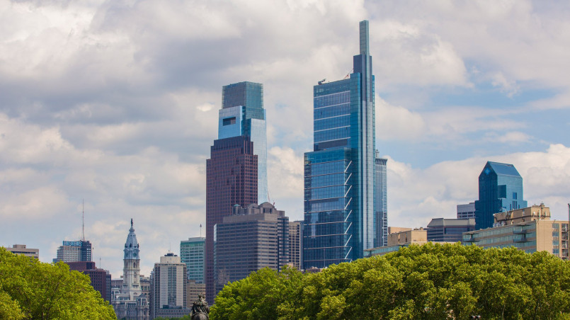 Comcast Center Philadelphia skyline Comcast Center's glass facade reflecting clouds against the Philadelphia skyline