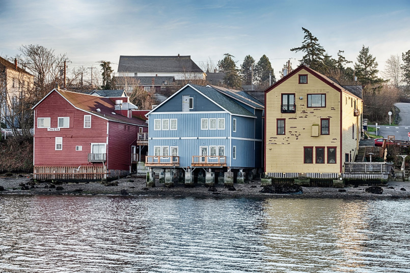 Historic Victorian-era waterfront buildings on pilings in Coupeville