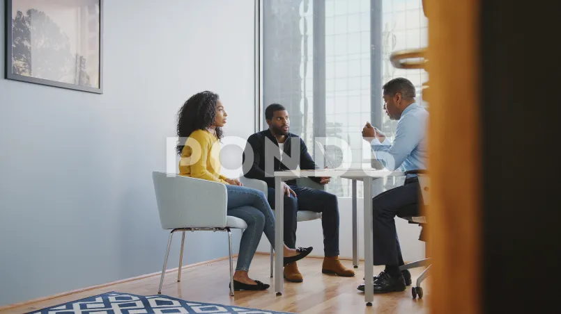 Married couple discussing retirement planning with financial planner