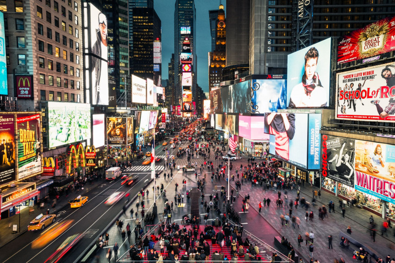 Pedestrians Times Square New York Crowds of pedestrians crossing at Times Square with bright billboards and city lights