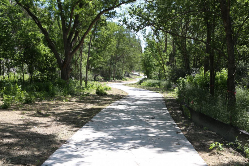 Cyclists riding on the Southern Walnut Creek Trail in Austin