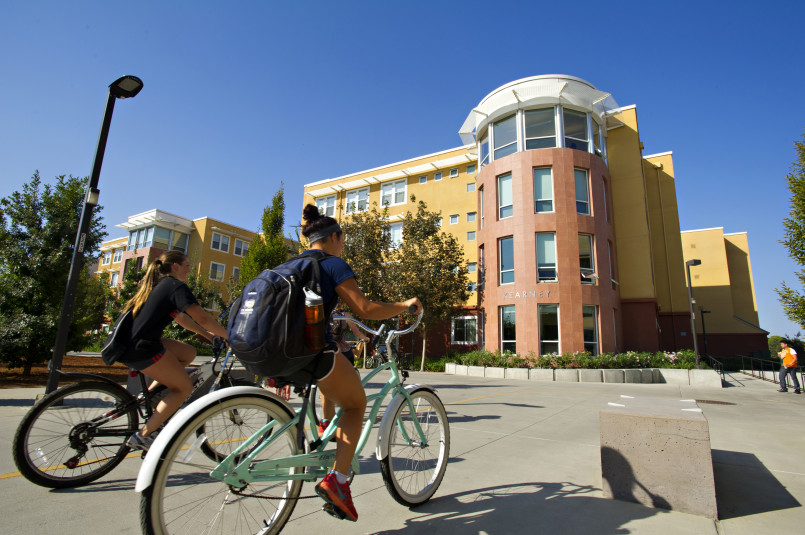 Davis California bike lanes with students cycling Students cycling on dedicated bike lanes in Davis, California near UC Davis campus