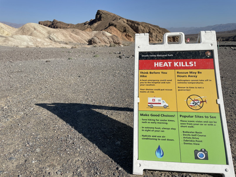 Badwater Basin salt flats in Death Valley with heat distortion visible in the distance