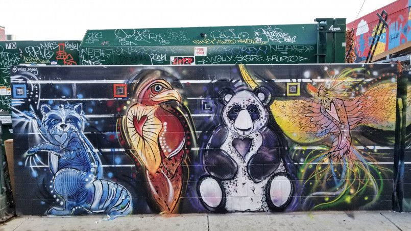 Denver rino district street art murals Colorful abstract mural on brick building in Denver's RiNo Art District