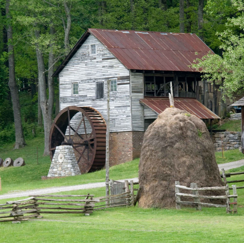 Early American Appalachian homestead Reconstruction of an 18th century mountain homestead with log cabin and small cultivated fields in a forest clearing
