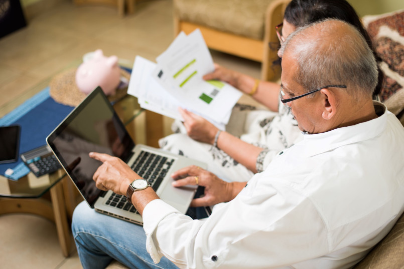 Senior couple examining Social Security retirement benefit statements