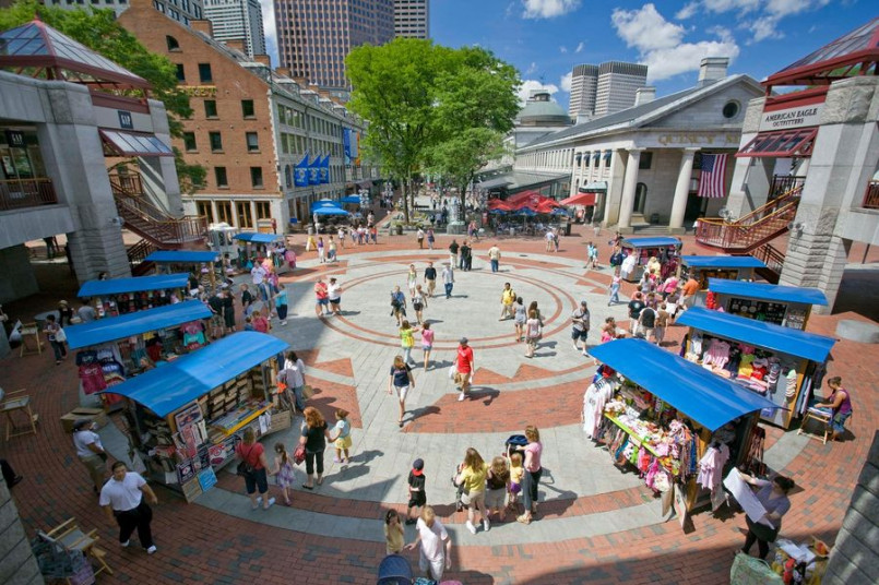 Exterior view of Faneuil Hall and Quincy Market with crowds of visitors