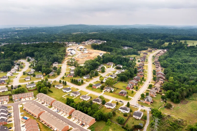Fiber optic installation in suburban neighborhood Technician installing fiber optic cables in a residential neighborhood
