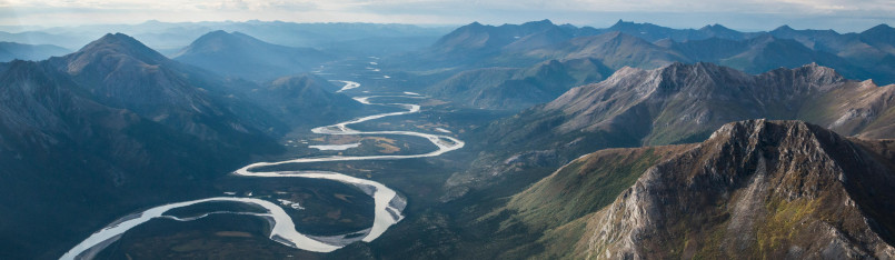 Gates of the Arctic National Park Alaska wilderness Dramatic mountain landscape with glacial valleys and clear river in Gates of the Arctic National Park, Alaska