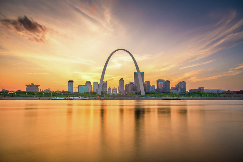Gateway Arch St Louis sunset Gateway Arch in St. Louis silhouetted against a colorful sunset sky