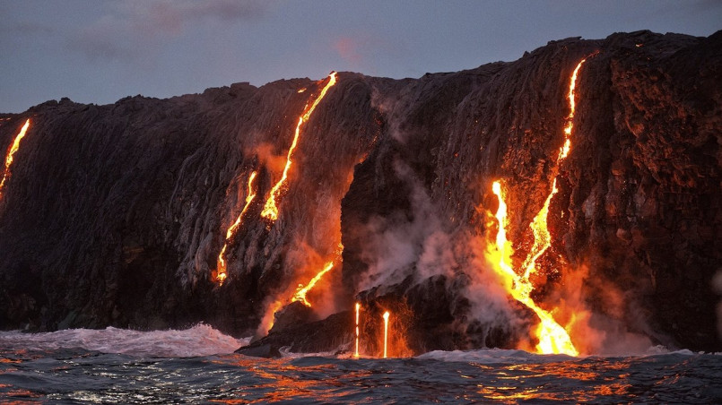 Glowing lava flow from Kilauea volcano on Hawaii's Big Island at night