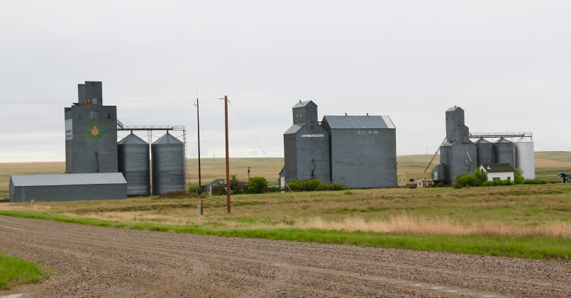 Small town in the Great Plains with prominent grain elevators dominating the skyline
