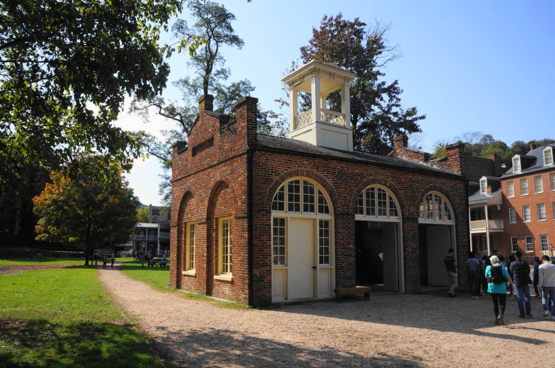 Historic Harpers Ferry nestled at the confluence of rivers with mountains in background