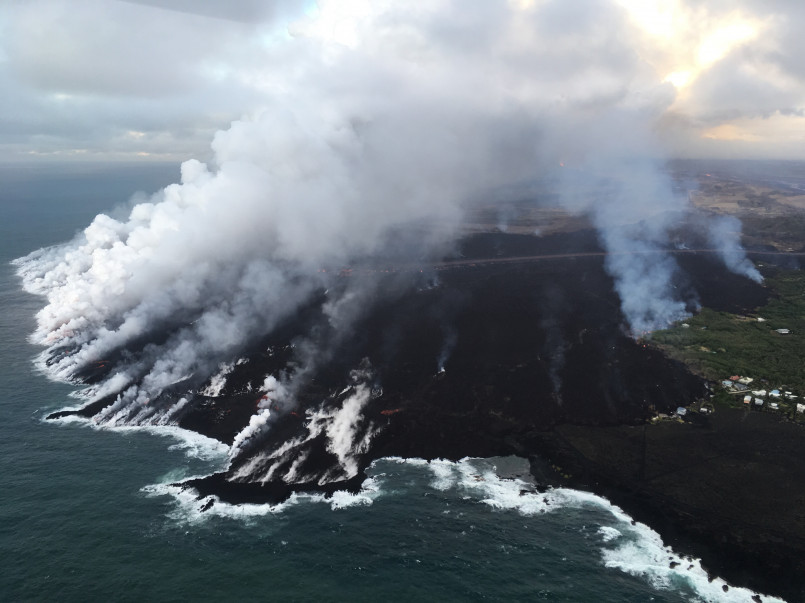 Hawaii volcanic coastline aerial Rugged volcanic coastline of Hawaii showing natural border formation