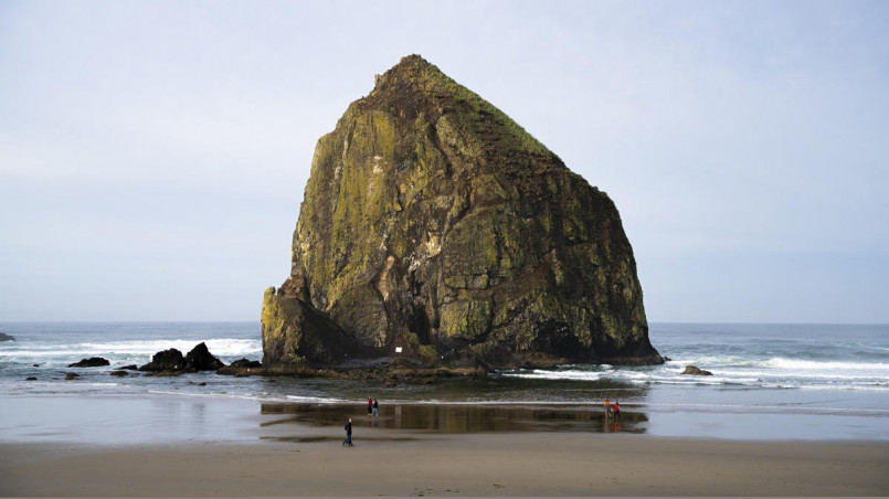 Cannon beach haystack rock oregon coast Haystack Rock standing majestically on Cannon Beach at sunset