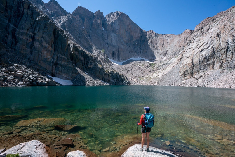 Hikers on alpine trail with mountain views in Rocky Mountain National Park