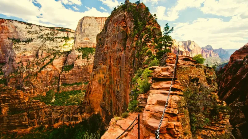 Hikers traversing the narrow ridge on Angels Landing trail in Zion National Park