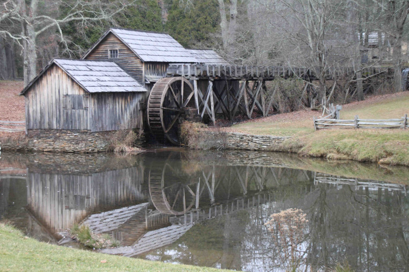 Traditional water-powered sawmill with wooden waterwheel