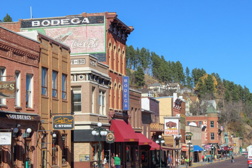 Deadwood South Dakota Main Street historic buildings Historic Main Street in Deadwood, South Dakota with preserved Old West architecture and period-dressed performers
