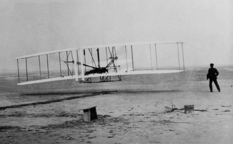 Historic photograph of the Wright brothers' first flight at Kitty Hawk