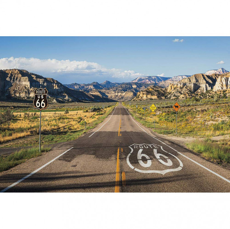 Historic Route 66 road sign with desert landscape in the background
