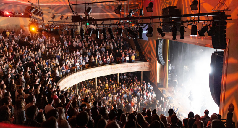 Nashville ryman auditorium Interior of the historic Ryman Auditorium in Nashville with colored glass windows and wooden pews