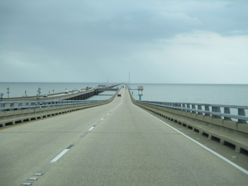 Lake Pontchartrain Causeway bridge Louisiana Lake Pontchartrain Causeway stretching across water with cars driving along its span
