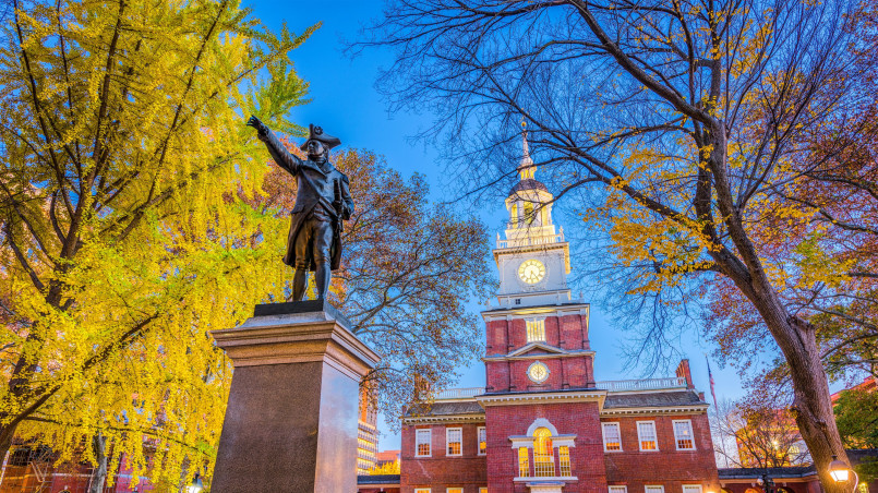 Visitors viewing the Liberty Bell in its glass pavilion at Independence National Historical Park