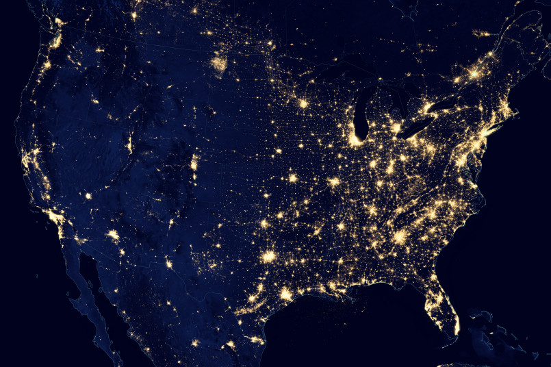 Map showing light pollution levels across the United States with dark sky areas highlighted