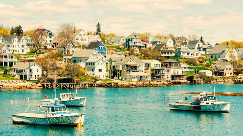 Small Maine coastal town with fishing boats and harbor