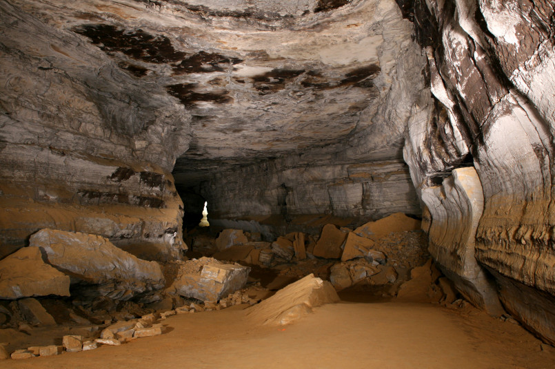 Dramatic limestone formations and passages inside Mammoth Cave illuminated by soft lighting