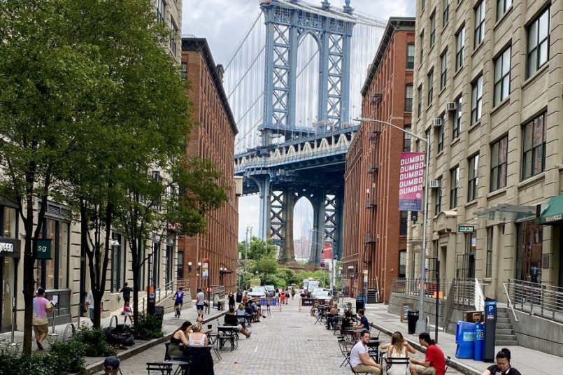 Manhattan Bridge view from DUMBO with Empire State Building framed by bridge