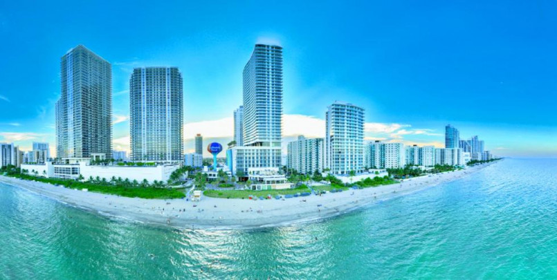 Miami beach skyline with palm trees and turquoise ocean waters