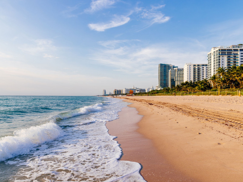 Miami skyline with beach Miami skyline with colorful Art Deco buildings and palm-lined beach