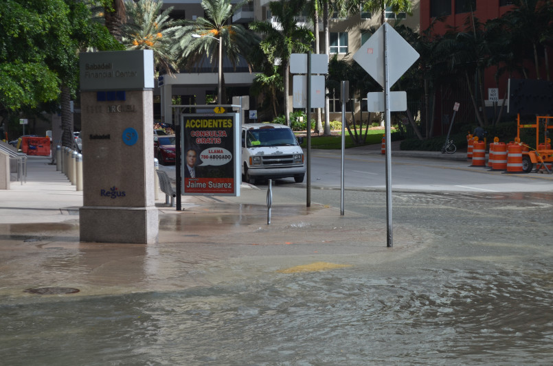 Miami sunny day flooding tidal Miami Beach street flooded during high tide on a clear sunny day