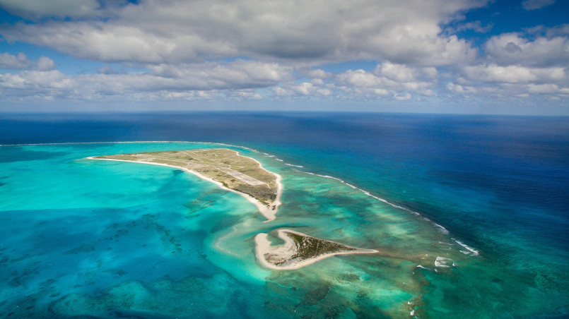 Aerial view of Midway Atoll with coral reefs and sandy beaches