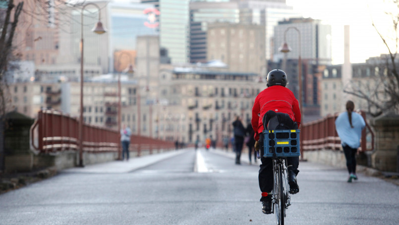 Minneapolis Midtown Greenway cyclists winter Cyclists using the Minneapolis Midtown Greenway during winter with snow on the ground