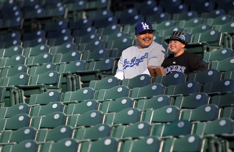 Aerial view of a packed Major League Baseball stadium during a day game