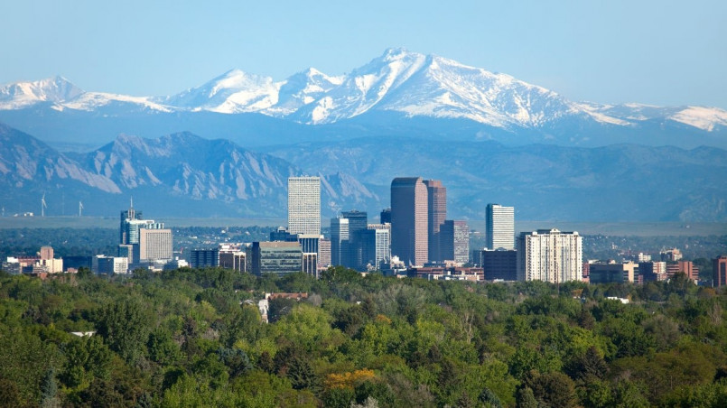 Modern tech campus in Denver with Rocky Mountains in the background